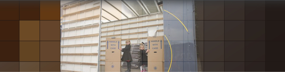 Children in van helping with 'handle with care' boxes