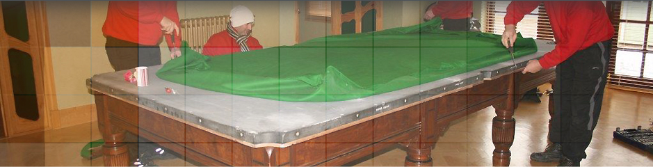 Removal Men putting a large table into storage